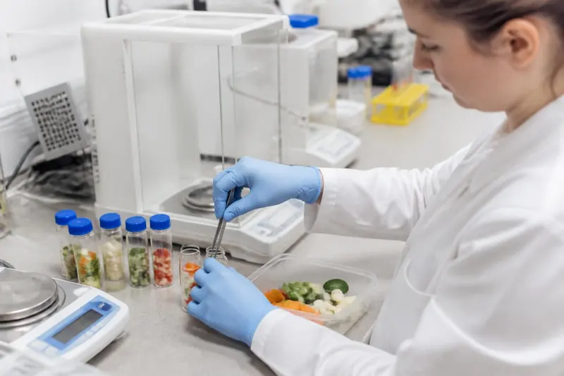 A laboratory technician preparing fresh vegetable samples for pesticide residue testing